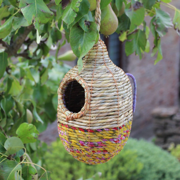 Artisan bird nest hung from a pear tree