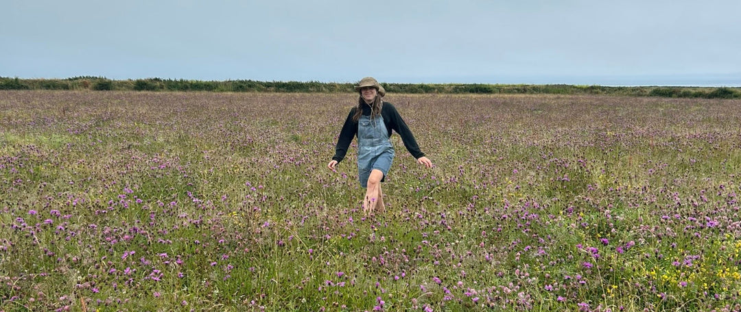 girl in a british meadow of clover red