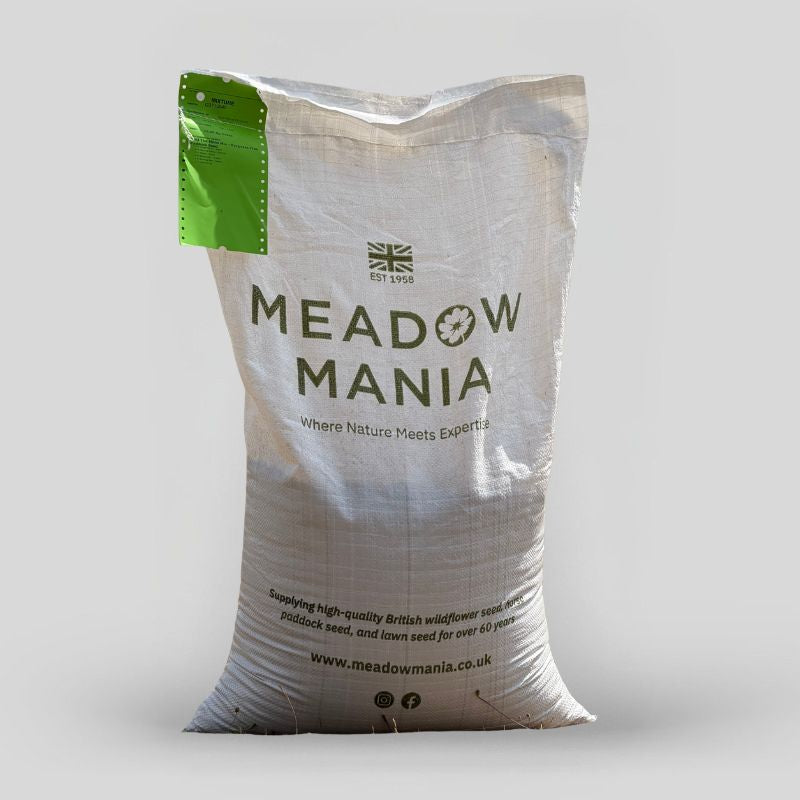A large white sack of Meadow Mania wildflower seed, featuring a green hangtag and dark green printed branding on a light gray background.