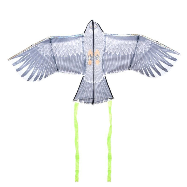 The kite part of the scarer kite on its own, spread out against a white background. Details of the feather print can be seen, as well as the feet and face of the bird. Two green streamers extend from the tail.